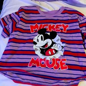 A Mickey Mouse shirt that has red and blue very nice